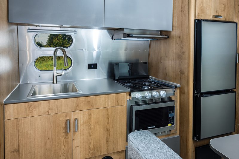 Interior kitchen of the 2025 Airstream Trade Wind 23FB travel trailer.