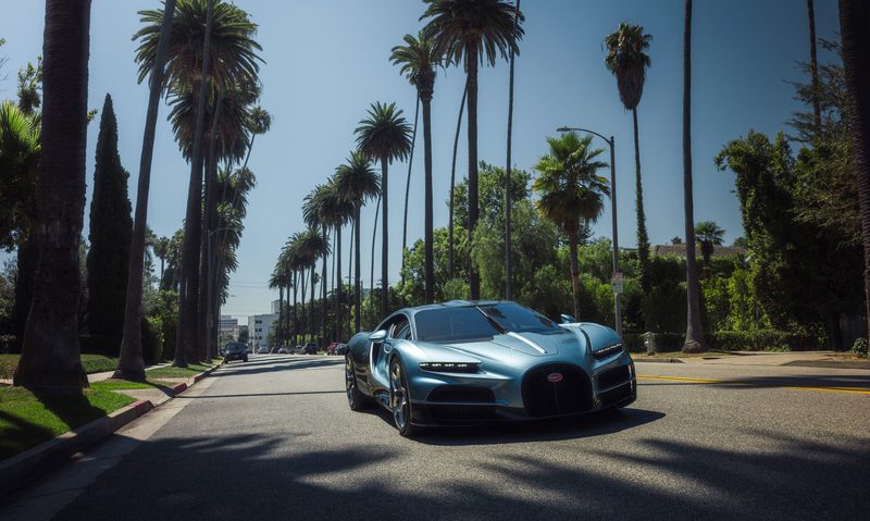 BUGATTI Tourbillon during US Roadshow driving down a Los Angeles street lined with palm trees.