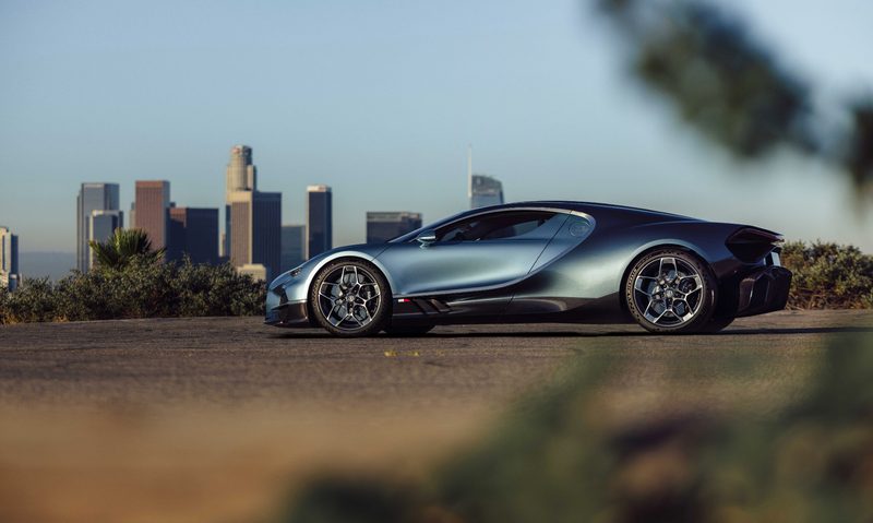 BUGATTI Tourbillon during US Roadshow parked on the side of the road with Los Angeles skyline in the background.