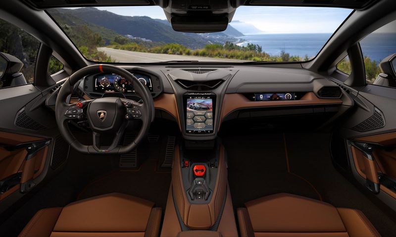 Lamborghini Temerario interior view of driver and passenger seats and dashboard looking out over a road through mounttains with an ocean view in the background.