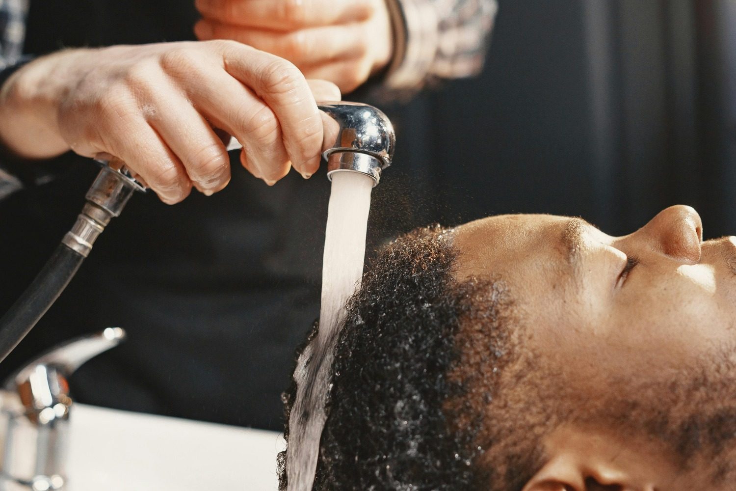 Man getting hair washed in salon