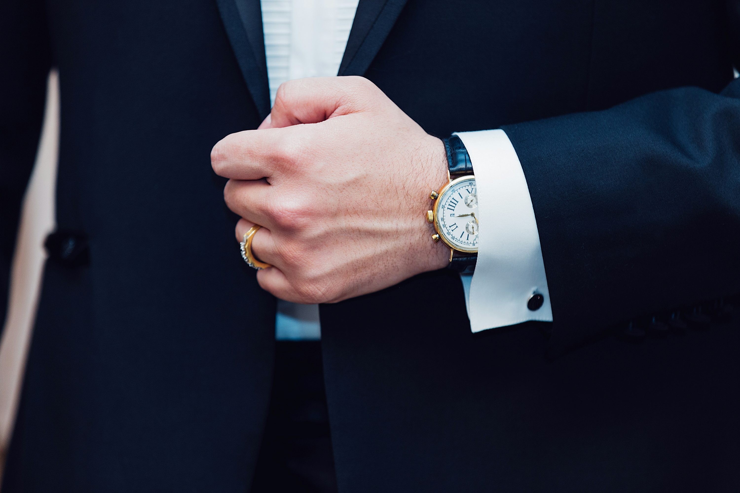 Man in tux with ring and watch