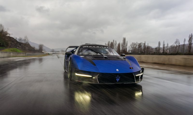 Maserati MCXtrema on a wet race track right front direct view.