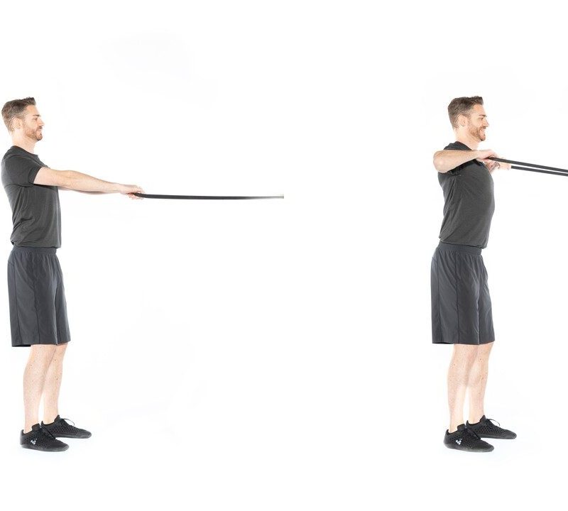 Man doing resistance band face pulls.