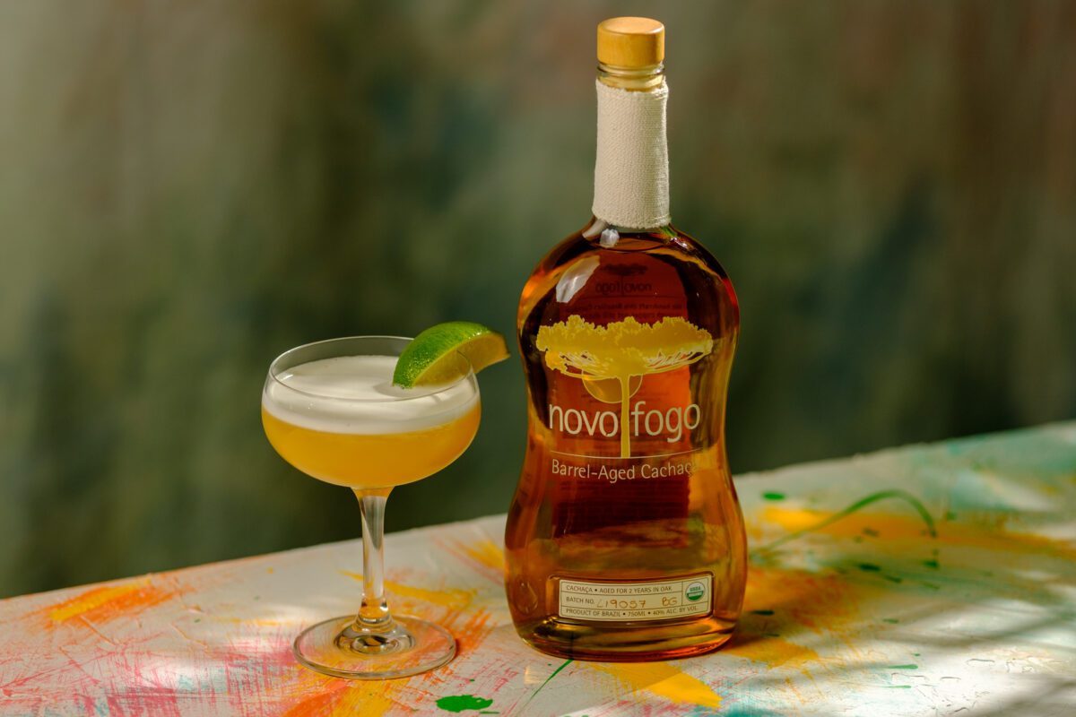 Novo Fogo Barrel Aged Cachaca with drinking glass