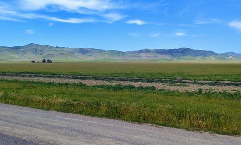 open field with California mountains in the background