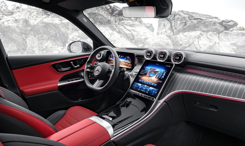 White 2025 Mercedes-Benz GLC 350e 4MATIC SUV interior showing front seats and dashboard with snow-covered mountains veisible through the windows.