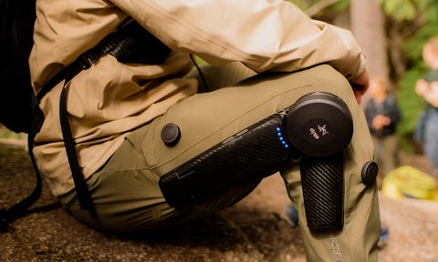 Closeup of seated man wearing Arc'teryx's new Mo/Go motorized hiking pants.