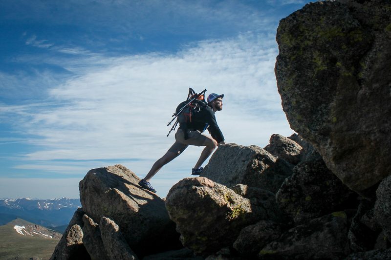 Man climbing a mountain