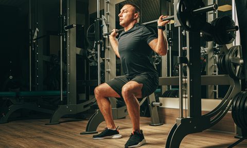 Man doing Smith machine squats