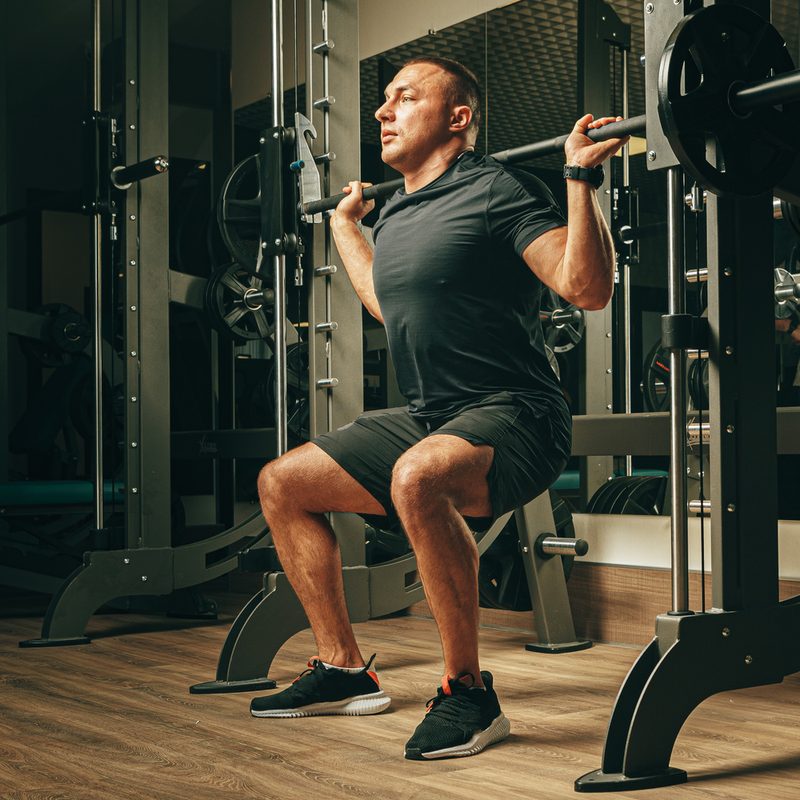 Man doing Smith machine squats