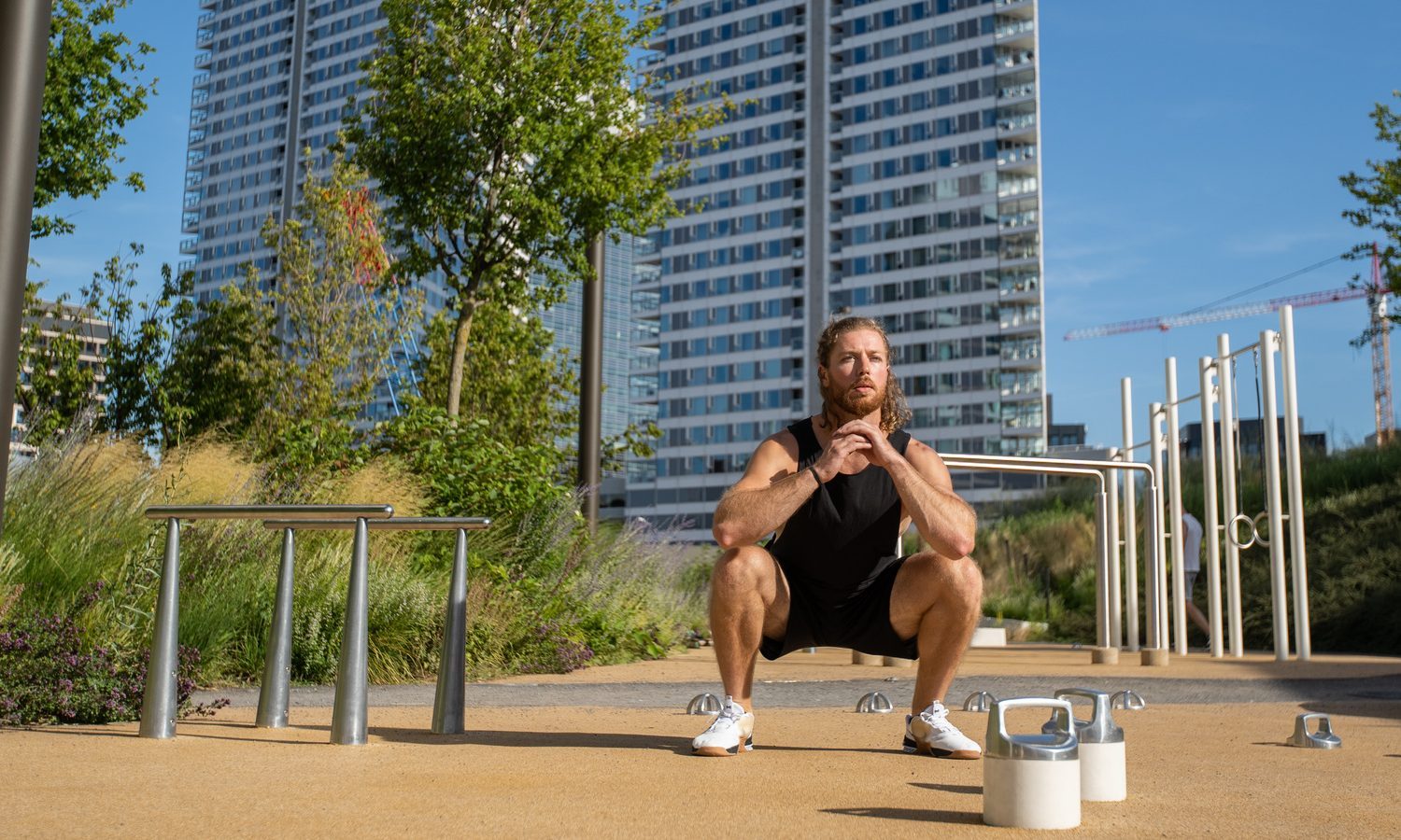 Man doing air squats.