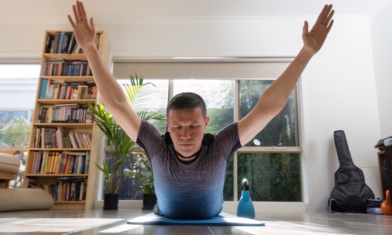 Man doing superman exercise.