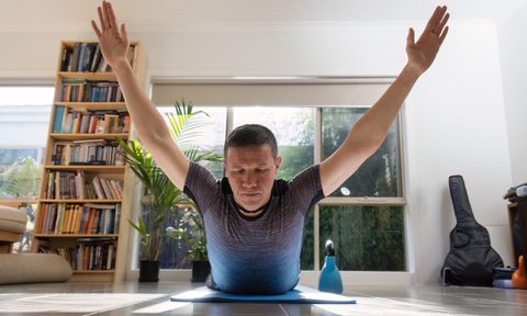 Man doing Superman exercise