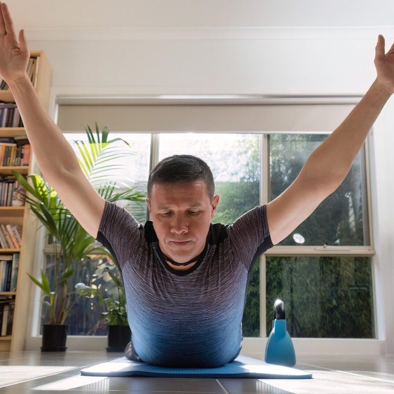Man doing superman exercise.