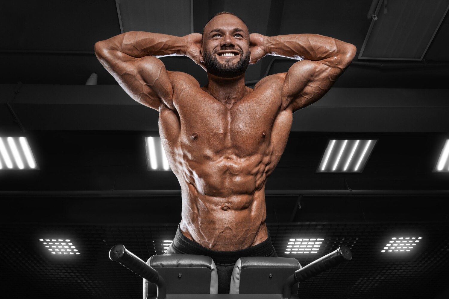 Man doing hyperextensions.