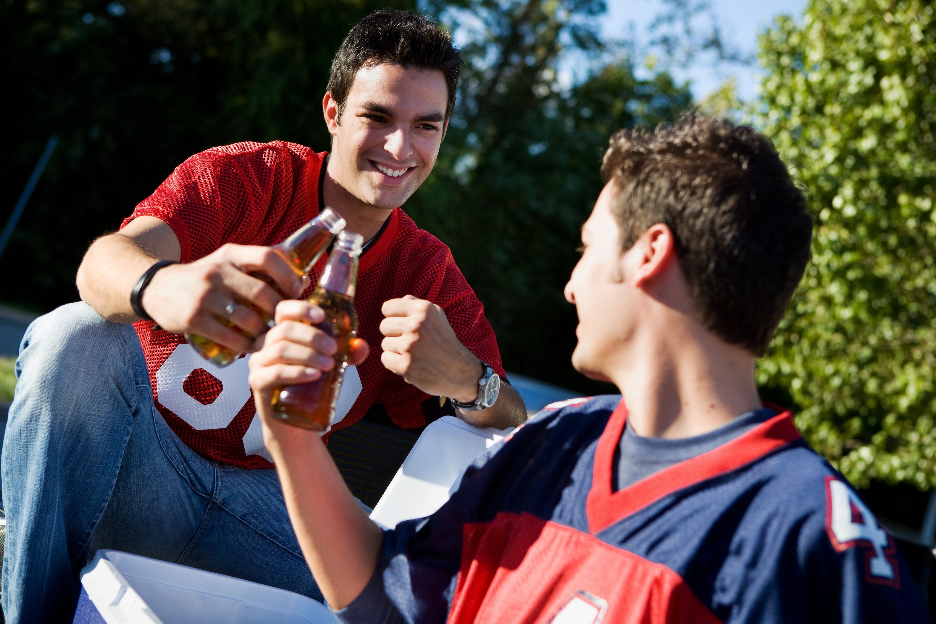 Group of friends doing football tailgating.