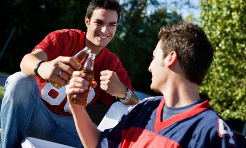 Group of friends doing football tailgating