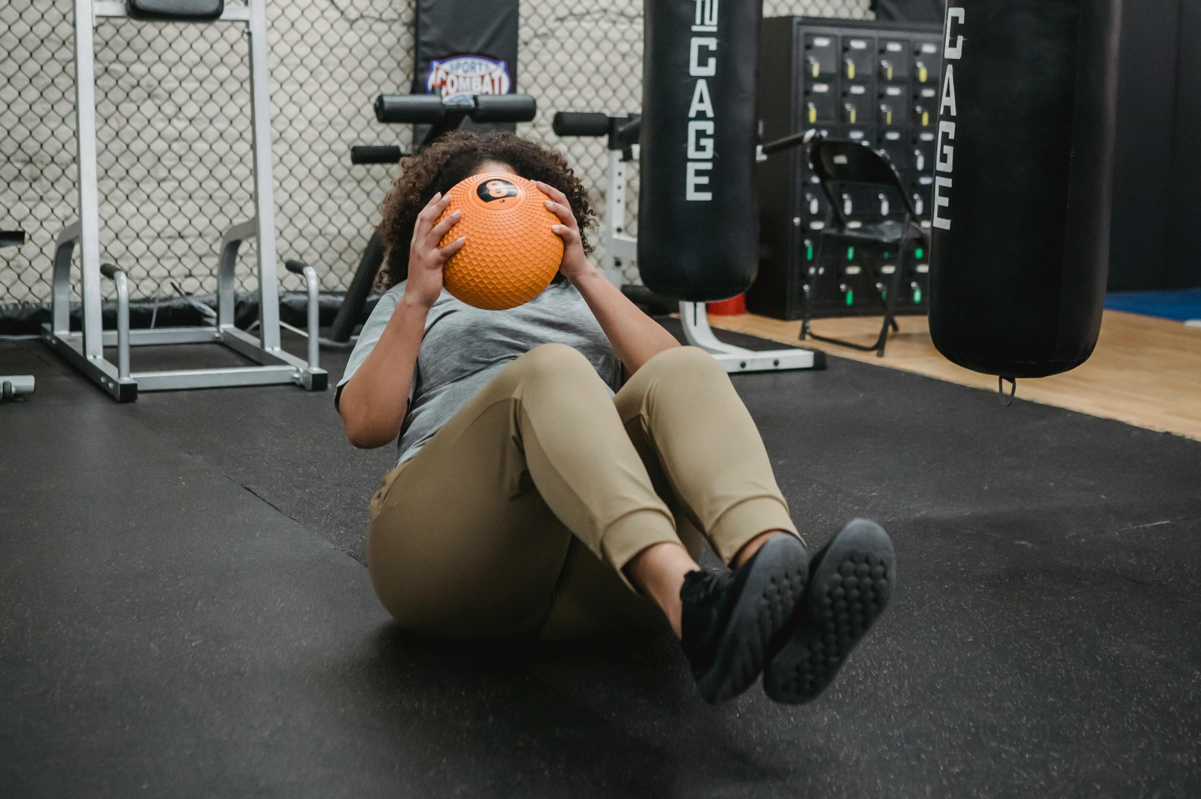 Woman doing Russian twists.