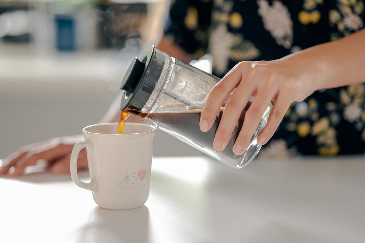 Pouring coffee from a French press