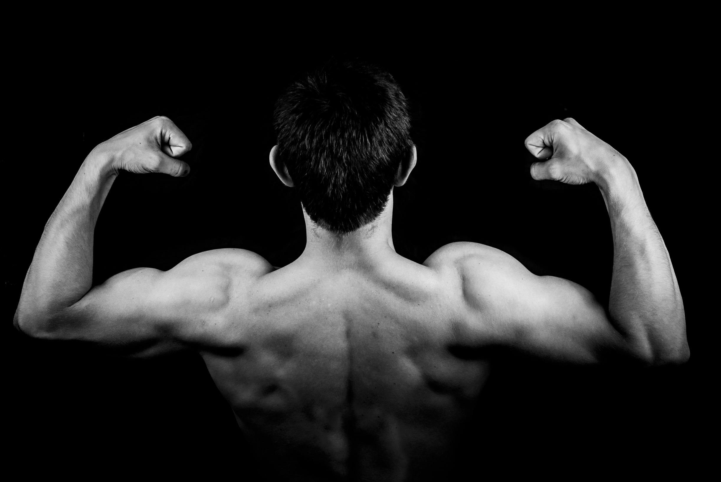 Man flexing back muscles