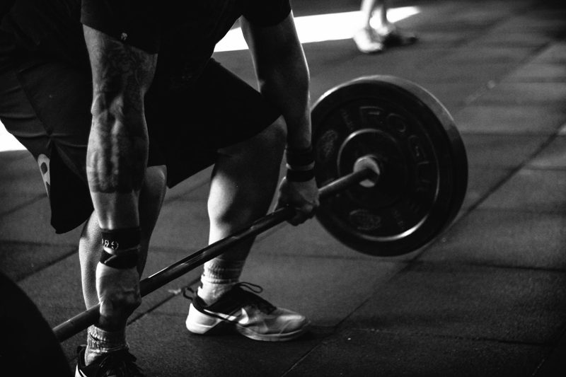 Close up of man lifting barbell