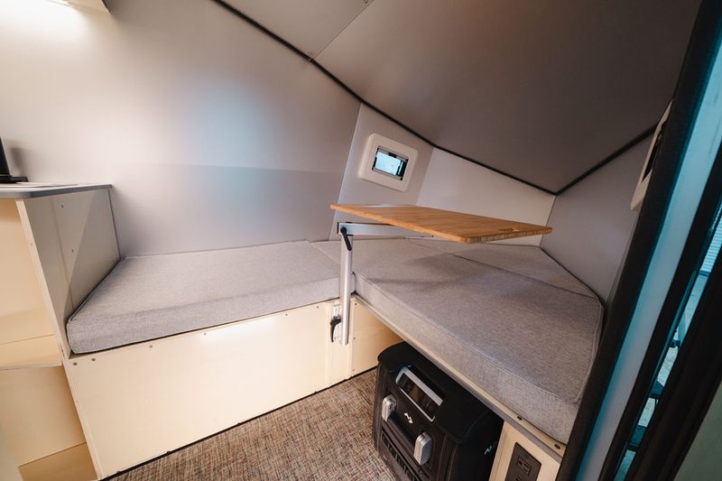 Interior and dinette of Polydrops' P21 camper trailer.