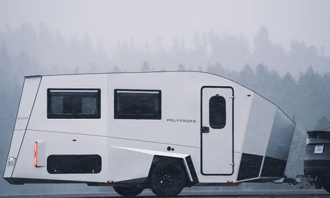 Tesla sedan towing a Polydrops P21 camper trailer
