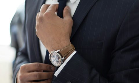 Man with watch and brown strap