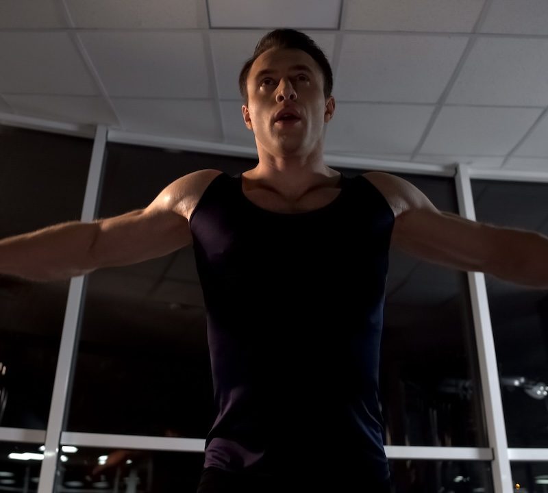 Man doing the cable fly