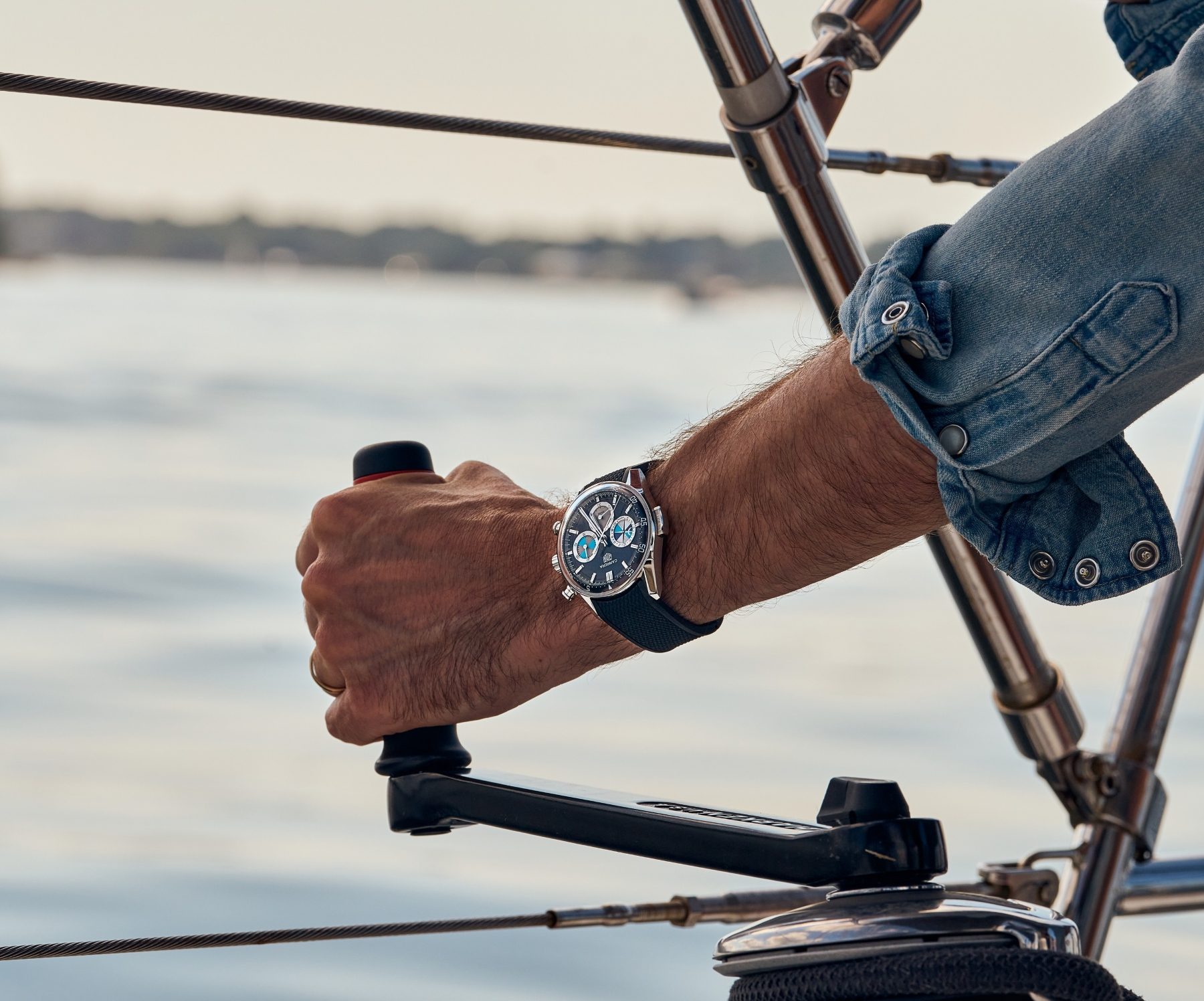Person wearing the Tag Heuer Carrera Chronograph Seafarer x Hodinkee watch while out on the water.