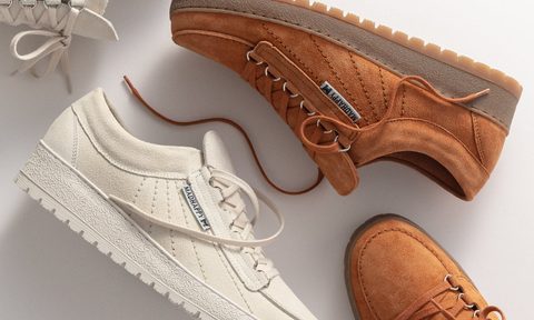 brown and white sneakers laying on table sideways