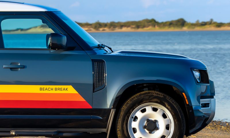 2024 Defender Beach Break limited edition parked by the beach front right side profile view.