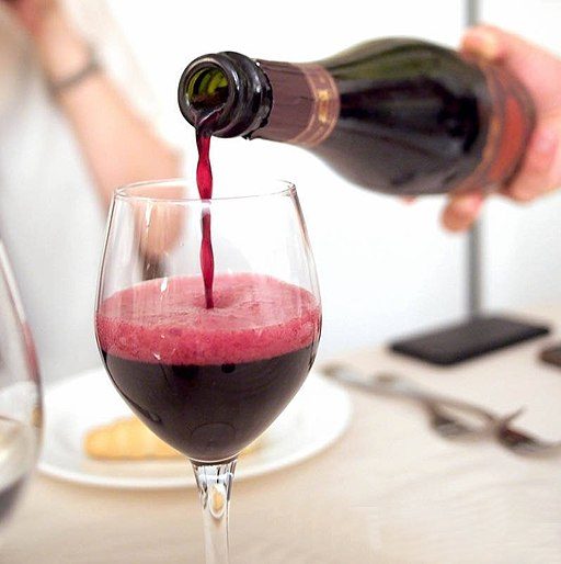 Lambrusco being poured into glass