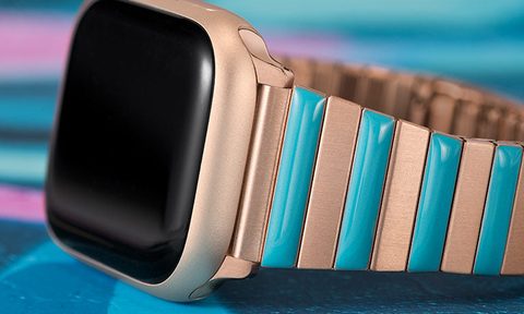 Timex Apple Watch bracelet in blue and gold on table