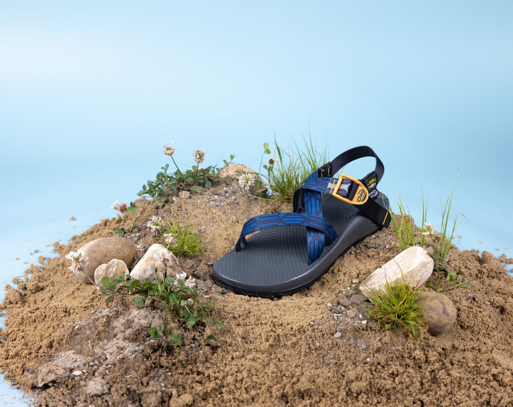 sandal sitting on mound of dirt
