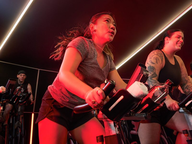 People at cycle bar taking a fun fitness class