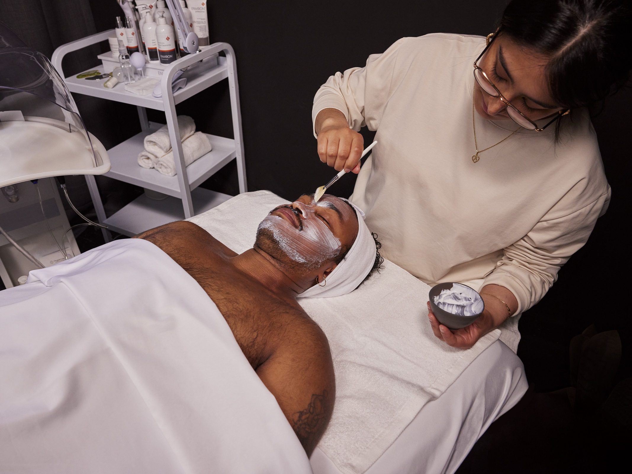 Man at spa getting cleansing facial through one month free trial to ClassPass