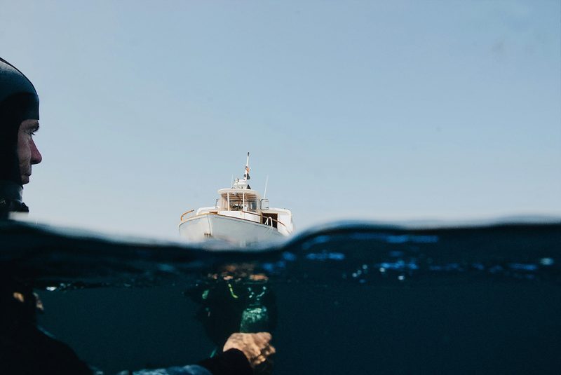 Diver with a boat in background
