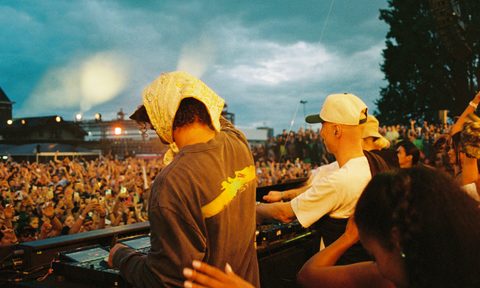 DJs playing in front of heavy crows