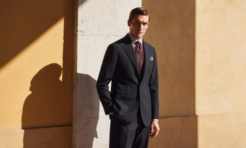 Man in Eton shirt and suit
