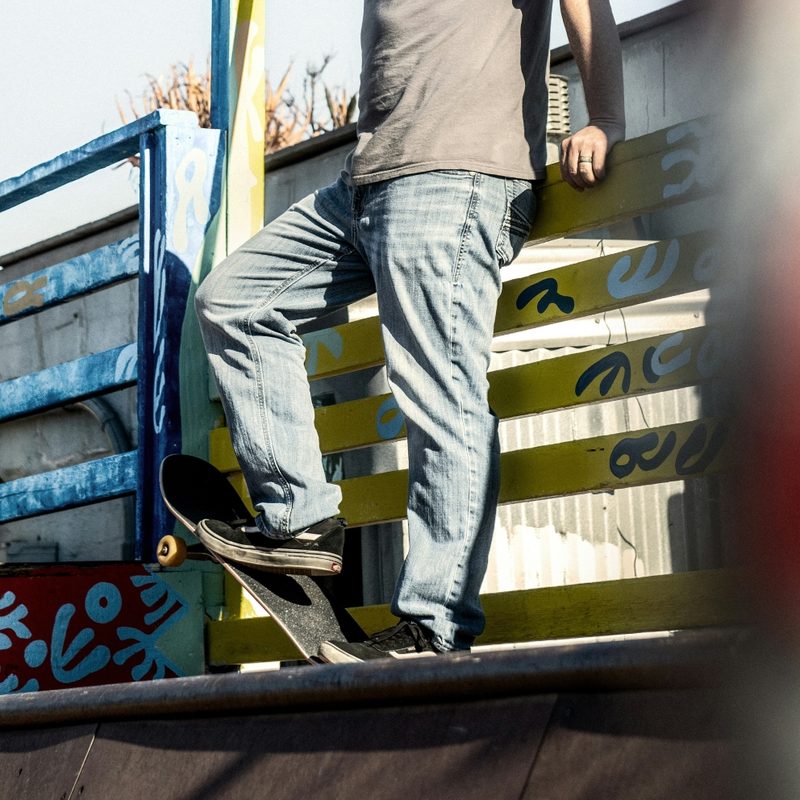 Man in baggy jeans with a skateboard