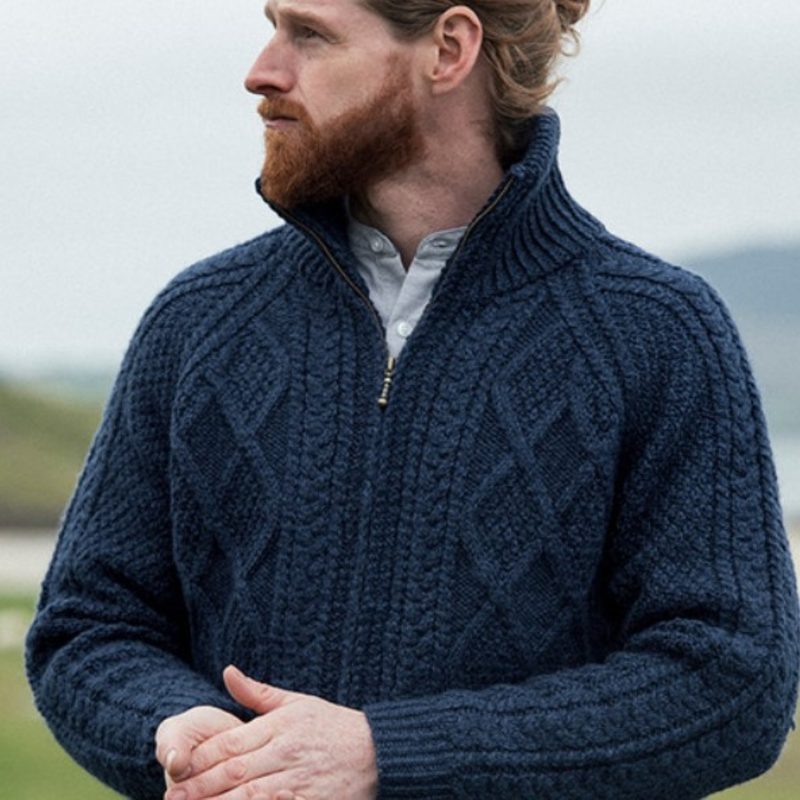 Man wearing a blue zip-up cardigan