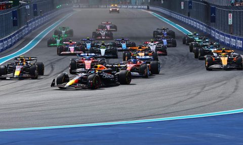 Race cars at the start of the 2024 F1 Miami Grand Prix.