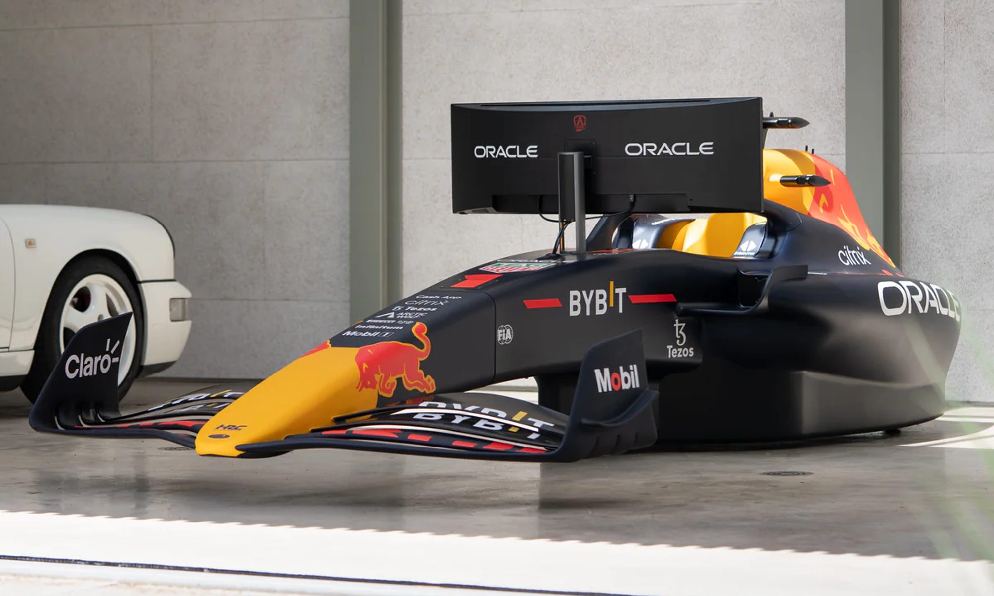 Red Bull RB18 Simulator parked inside a garage facing out.