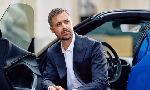 tom luthi hockerty clothing collection leaning out of a car