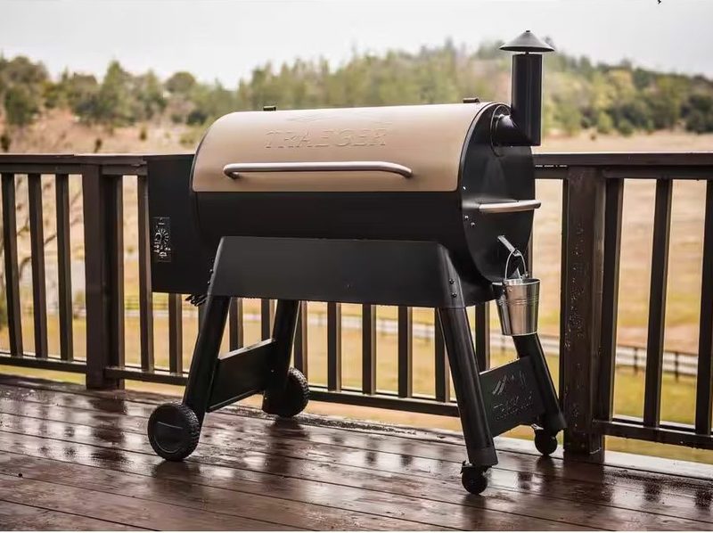 The Traeger Grill Pro Series 34 Pellet Grill out on a wet deck.