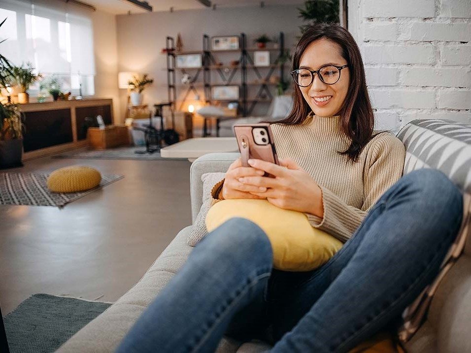 Woman booking hotels through Choice Hotels app and site