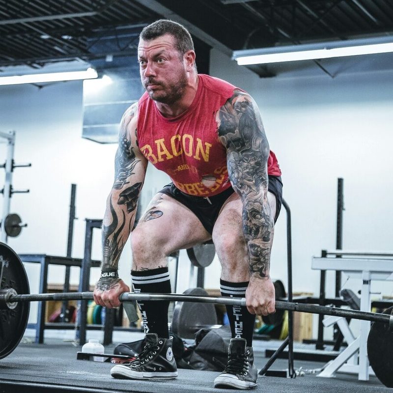 Man deadlifting