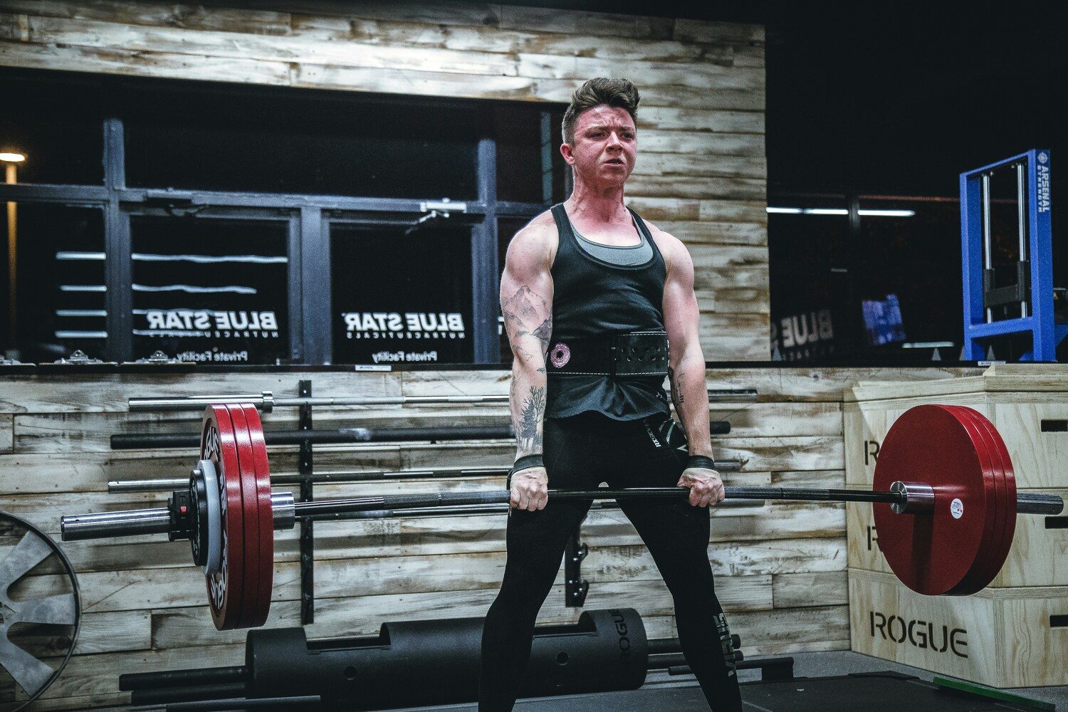 Man doing deadlifts.